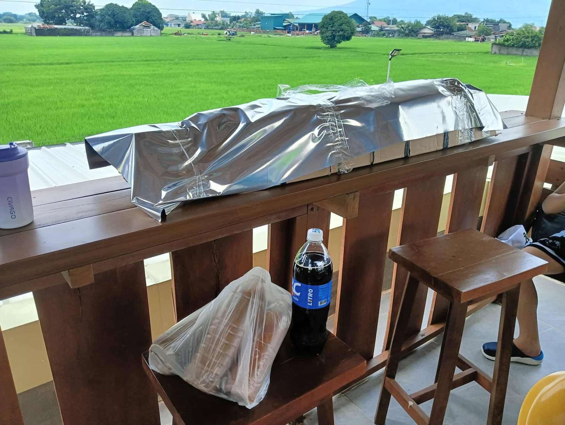 Lechon delivery in Pampanga with a view of the rice fields