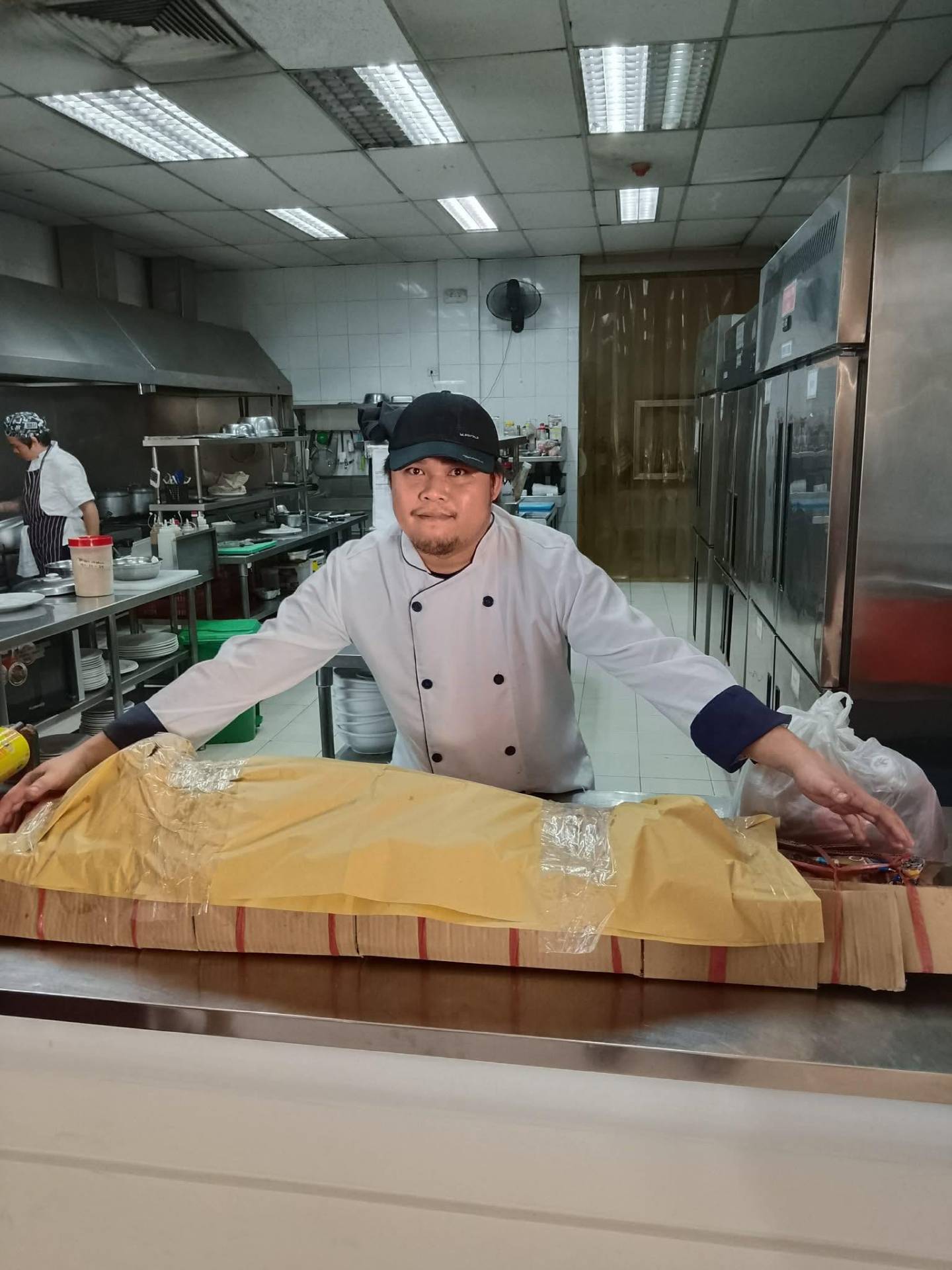 Chef preparing fresh lechon in our kitchen